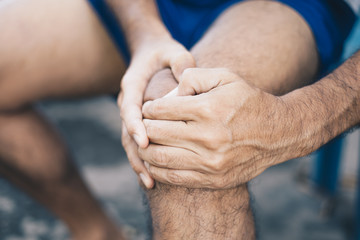 Health care concepts, Young man with a knee pain