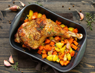 baked turkey thigh with vegetables.