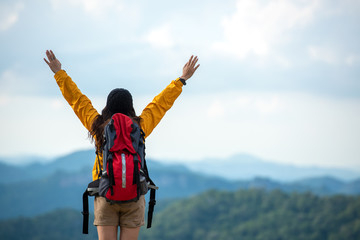 Hiker asian women raise hand and pointing happy feeling freedom good and strong weight victorious...