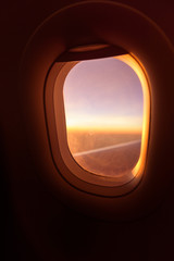 plane window ,beautiful sunset on the plane warm tone sunset