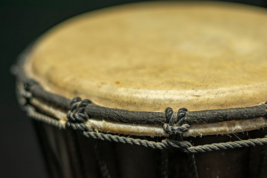 Djemb&eacute; in the foreground with tension and tuning strings