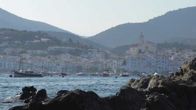 partial scene in cadaques sea with the ancient buildings and houses in the city. lovely wide shot