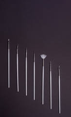white nail design brushes on black background