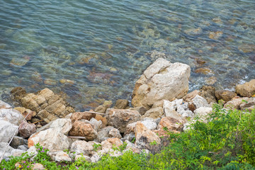 The rocky shore of the sea. Turquoise beautiful water.