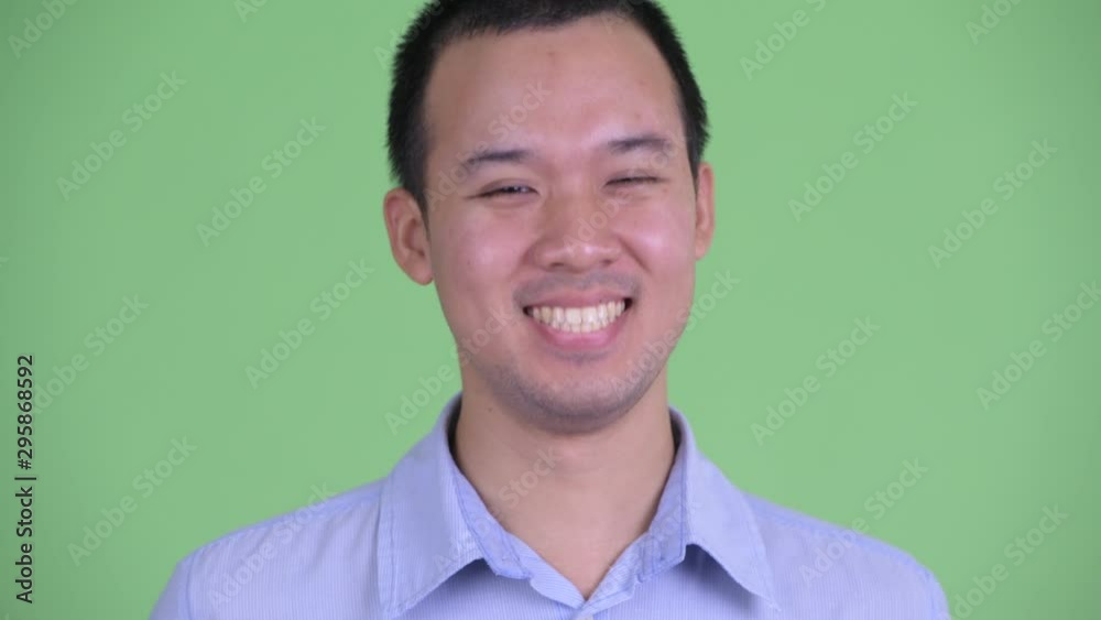 Wall mural Face of happy Asian businessman smiling