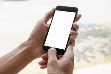 Smart phone showing blank screen in man hand with blurred Background
