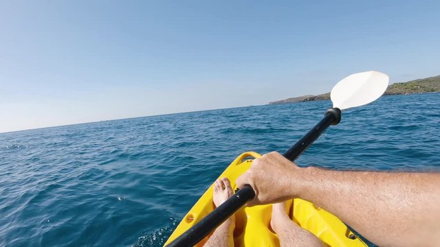First person view kayaking in the mediterranean sea on a sunny summer day. Concept about summer, lifestyle,wanderlust travel and nature
