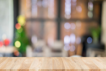 Empty wooden table and blurred cafe background, can be used for display or montage your products