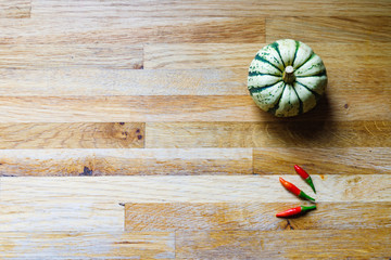 Squash Chillies on wood