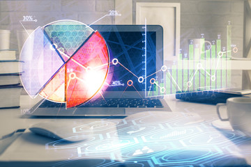 Financial graph colorful drawing and table with computer on background. Double exposure. Concept of international markets.