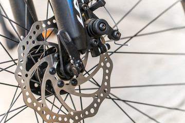 Fototapeta na wymiar Brake disc of a front bicycle wheel. close up photo