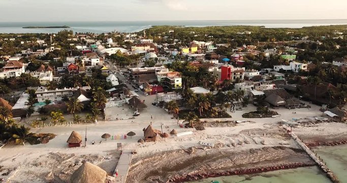 Camera is moving away from caribbean island with white sand beach and turquoise water