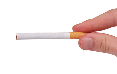 Fingers holding a cigarette isolated on white background