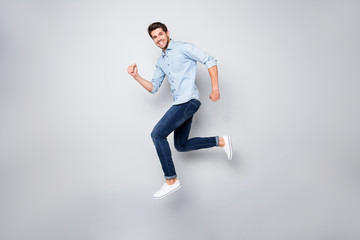 Full length body size photo of cheerful nice excited ecstatic man overjoyed with being able to jump...