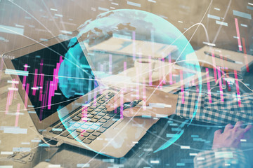 Double exposure of forex chart with man working on computer on background. Concept of market analysis.