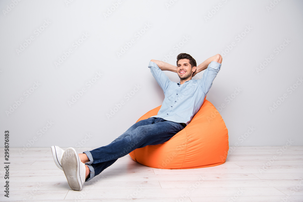 Poster turned full length body size photo of cheerful confident relaxing man sitting in chair thinking gues