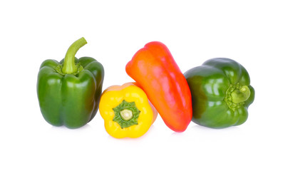 Sweet peppers green yellow red on white background
