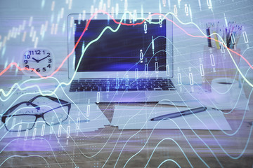 Forex market chart hologram and personal computer background. Double exposure. Concept of investment.