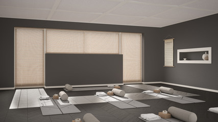 Empty yoga studio interior design, open space with mats, pillows and accessories, venetian bamboo blinds, herringbone parquet, big window, ready for yoga practice, meditation room