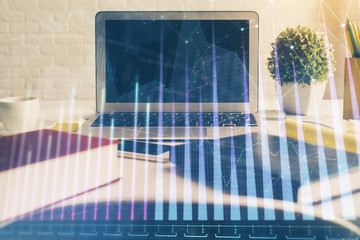 Forex market chart hologram and personal computer background. Double exposure. Concept of investment.