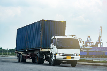 Cargo blue Container truck in ship port Logistics.Transportation industry in port business concept.import,export logistic industrial Transporting Land transport on Port transportation storge 