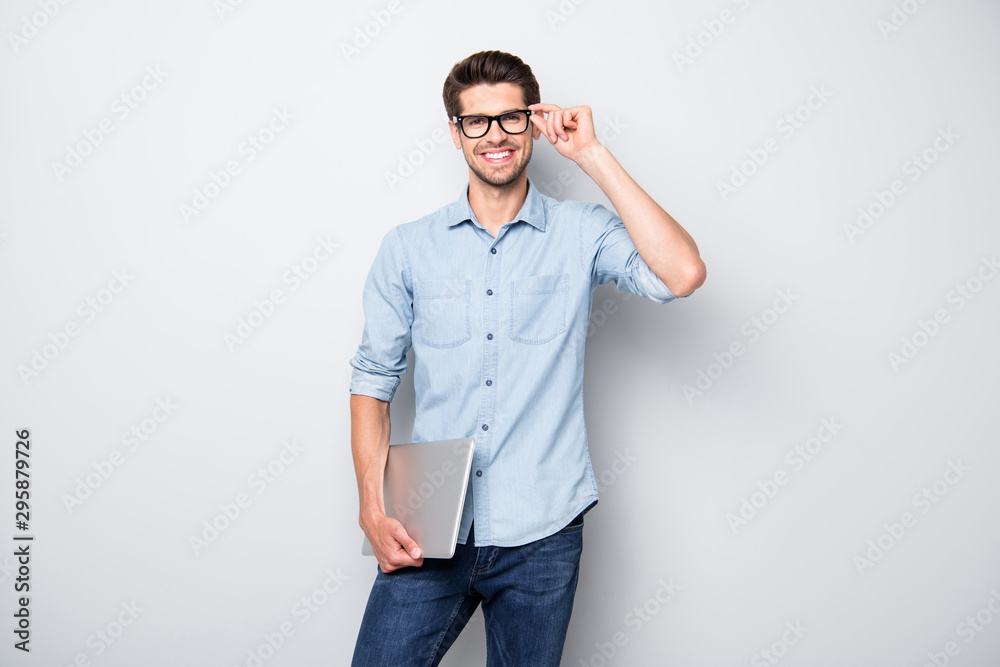 Aufkleber photo of cheerful handsome attractive clever man smiling toothily holding laptop with hands showing 