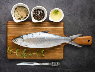 Flat lay tasty fish on cutting board