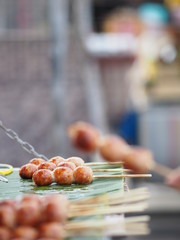 Artificial sausage Thai sausage casing cooking twine made from minced pork and rice take to grill put on green banana leaves