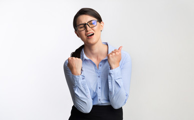Sad Businesswoman Shaking Fists In Disappointment Standing In Studio