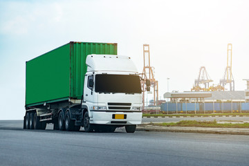 Cargo green Container truck in ship port Logistics.Transportation industry in port business concept.import,export logistic industrial Transporting Land transport on Port transportation storge