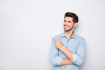 Attention sales. Portrait of positive cheerful businessman promoter guy point index finger recommend discounts indicate promo wear casual style outfit isolated over grey color background
