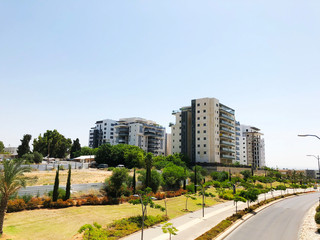 RISHON LE ZION, ISRAEL  October 07, 2019: Residential buildings , plants and street   in Rishon Le Zion, Israel