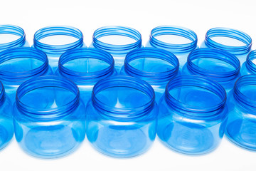 Blue plastic jars on a white background isolate, polyethylene terephthalate, tara