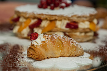 Sfogliatella, typical Neapolitan pastry, with yellow cream and strawberry, Naples, Italy