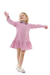 A little girl in a dress is spinning. © lotosfoto