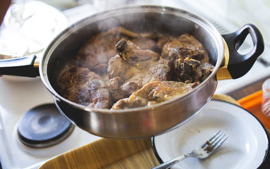 Pork chop is fried in a pan stock photo