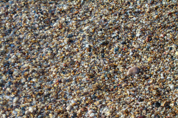 sea pebbles colored granite on the beach