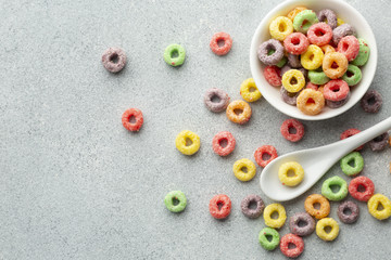 Top view colorful cereal and plastic spoon