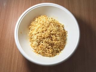 Noodles in a wooden table top cup