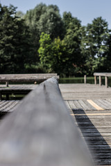 Fototapeta na wymiar Wooden raft on the water with railings