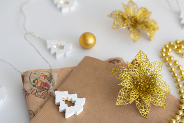 Obraz na płótnie Canvas Christmas wrapping paper and Christmas toys on a white background