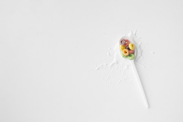 Top view plastic spoon with cereal