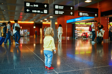 Adorable little girl alone in the airport