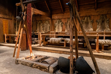 Inside the replica of a furnished viking longhouse 