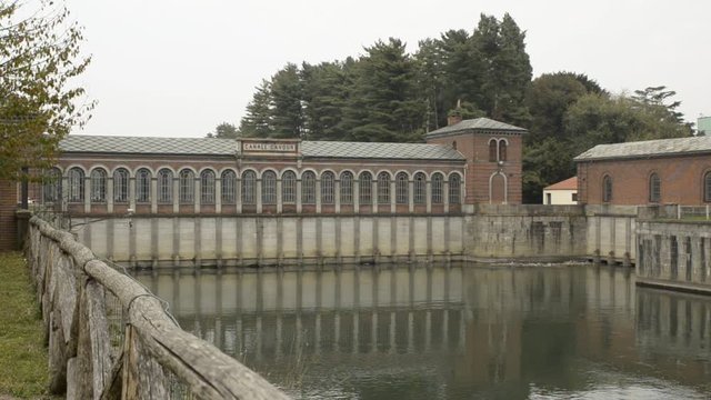 Chivasso, Piedmont, Italy. October 2019. The Cavour canal is a great work from the 1800s that captures the waters of the river Po. In the video the red brick sewer. Fixed framing.