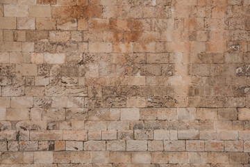Old and weathered large stone blocks wall texture. Beige sandstone tones - Powered by Adobe