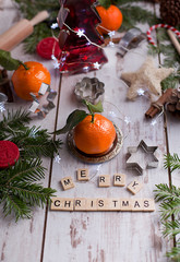 Christmas decoration with mandarins,cookies,berries and spices