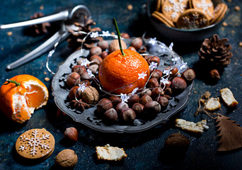 Christmas decoration with mandarins,cookies,berries and spices