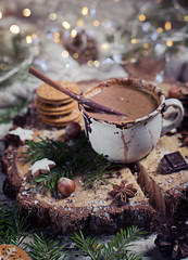 Fototapeta na wymiar Christmas hot chocolate, decor with nuts, spices