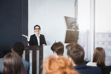 Business woman giving presentation at conference room